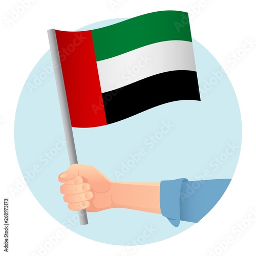 united arab emirates flag in hand