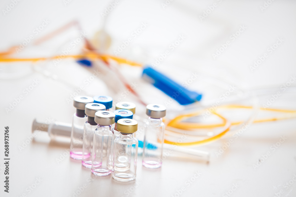 Medical background with  syringe and vaccine bottles