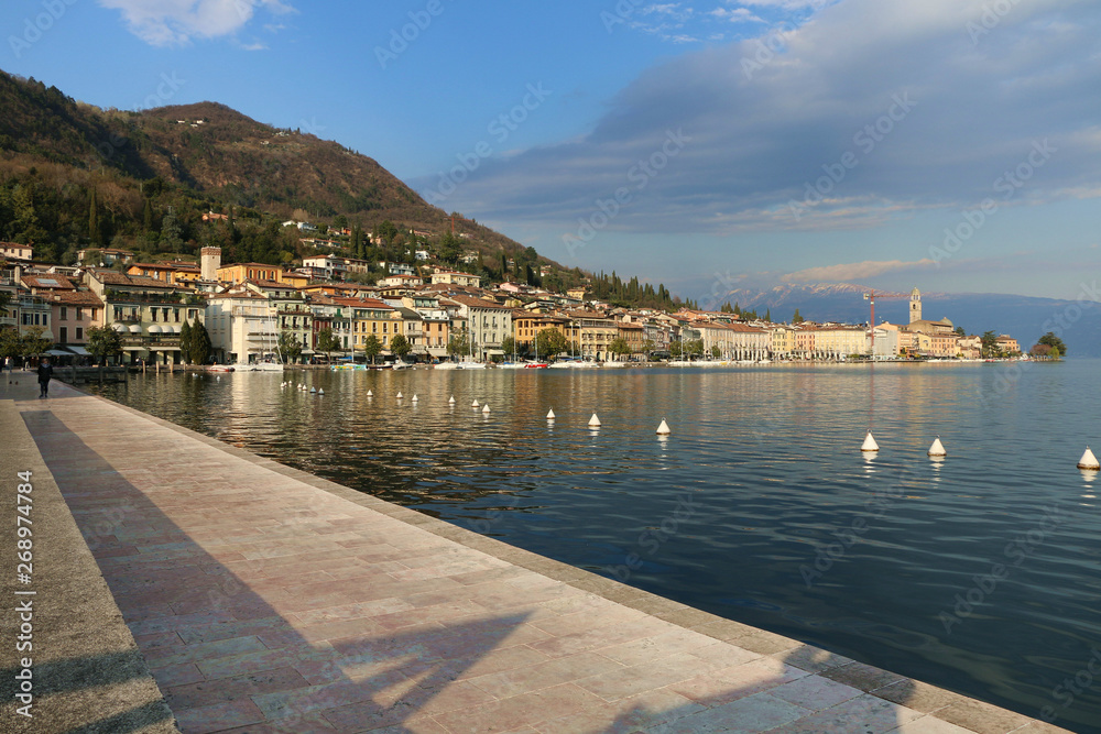 Fototapeta premium Salò, Garda lake, Italy. The promenade of the city in front of the lake.