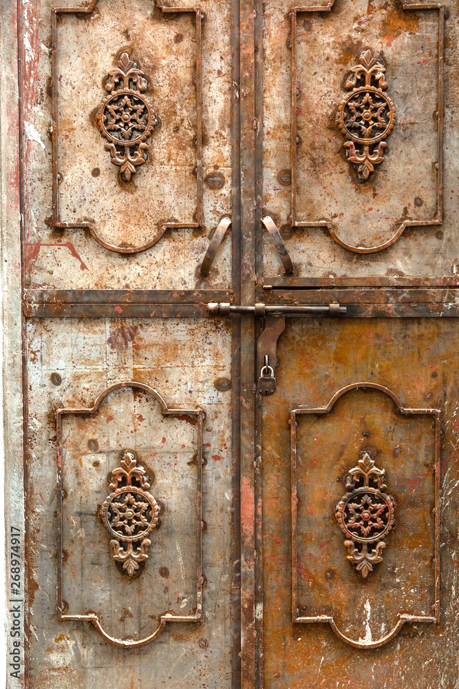 Lock on an old wooden door in India