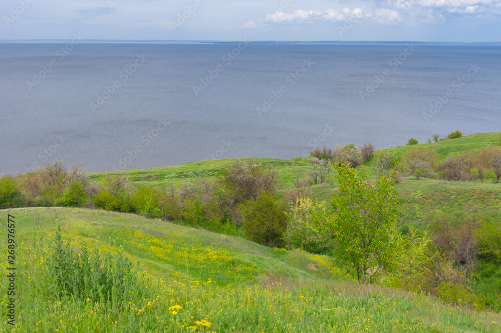 Spring hilly landscape Kakhovka Reservoir riverside located on the Dnipro River near Skelki village, Ukraine