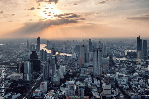 Above view of Sunset on Crowded building with Chao Phraya river at Bangkok