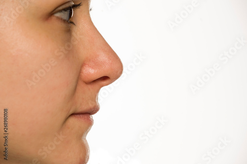 Clseup profile of woman without makeup on white background