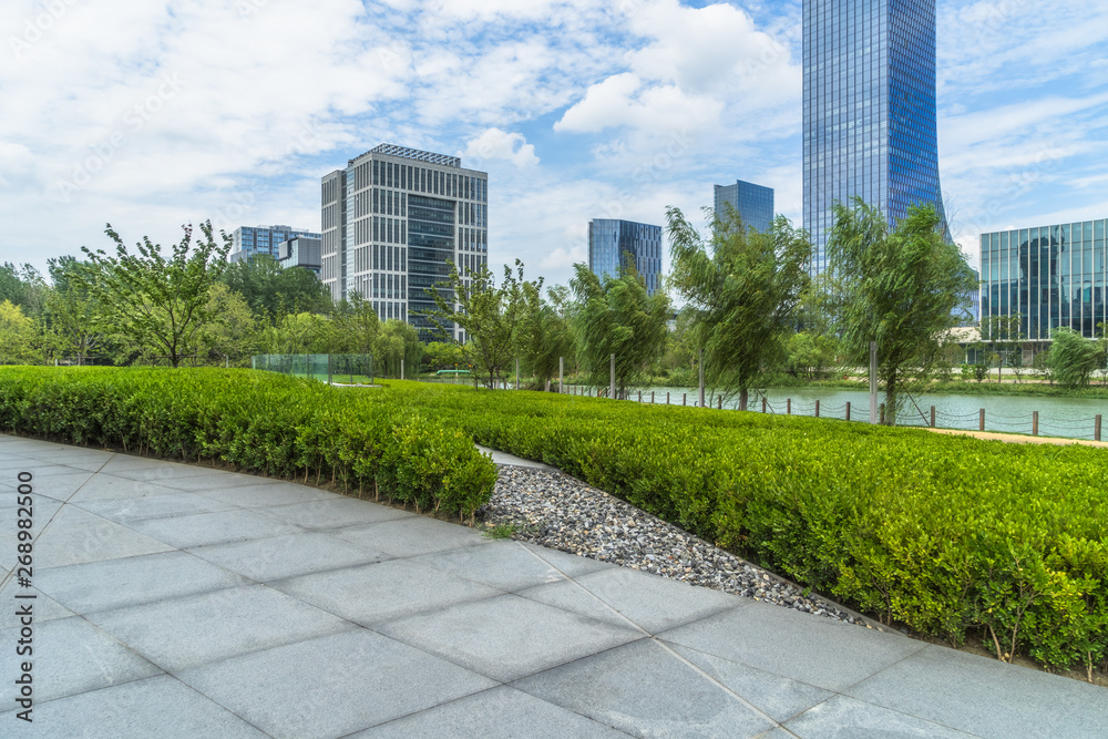 beautiful green meadow near modern office building. beautiful green meadow near modern office building.