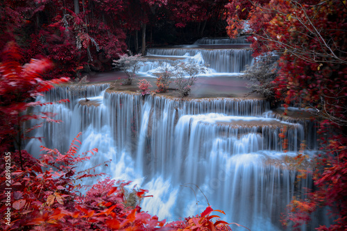 Fototapeta Naklejka Na Ścianę i Meble -  long exposure waterfall in the park and change the leaves color over red