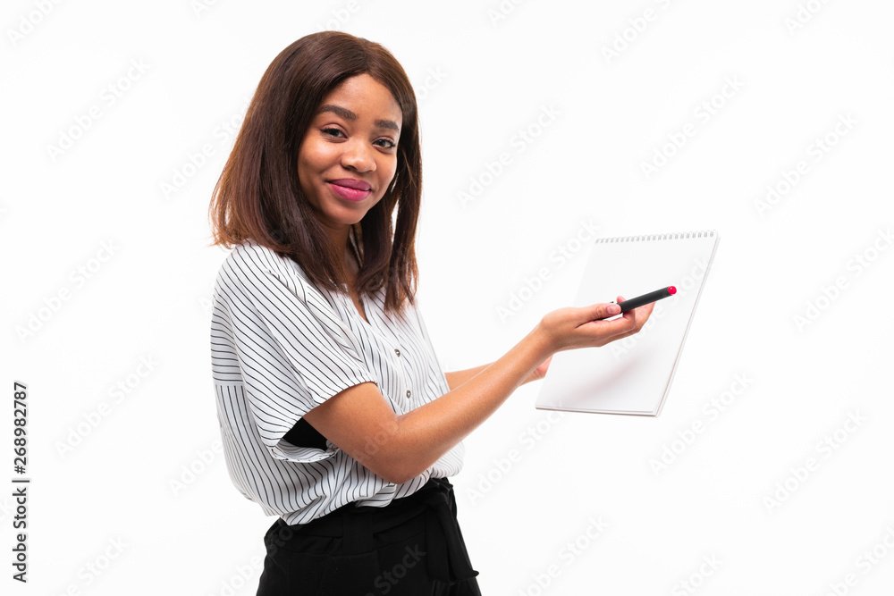 charming dark-skinned young girl explain smth on the plane table isolated on background charming dark-skinned young girl explain smth on the plane table isolated on background