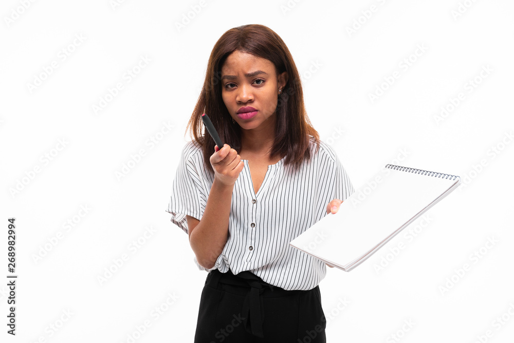 charming dark-skinned young girl explain smth on the plane table isolated on background charming dark-skinned young girl explain smth on the plane table isolated on background