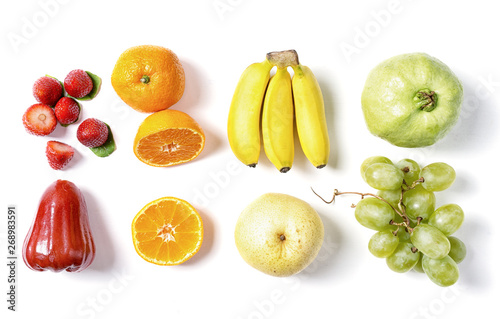 Fototapeta Naklejka Na Ścianę i Meble -  Fresh fruits in raws on white background. Red, orange, yellow and green. Food ingredients, detox