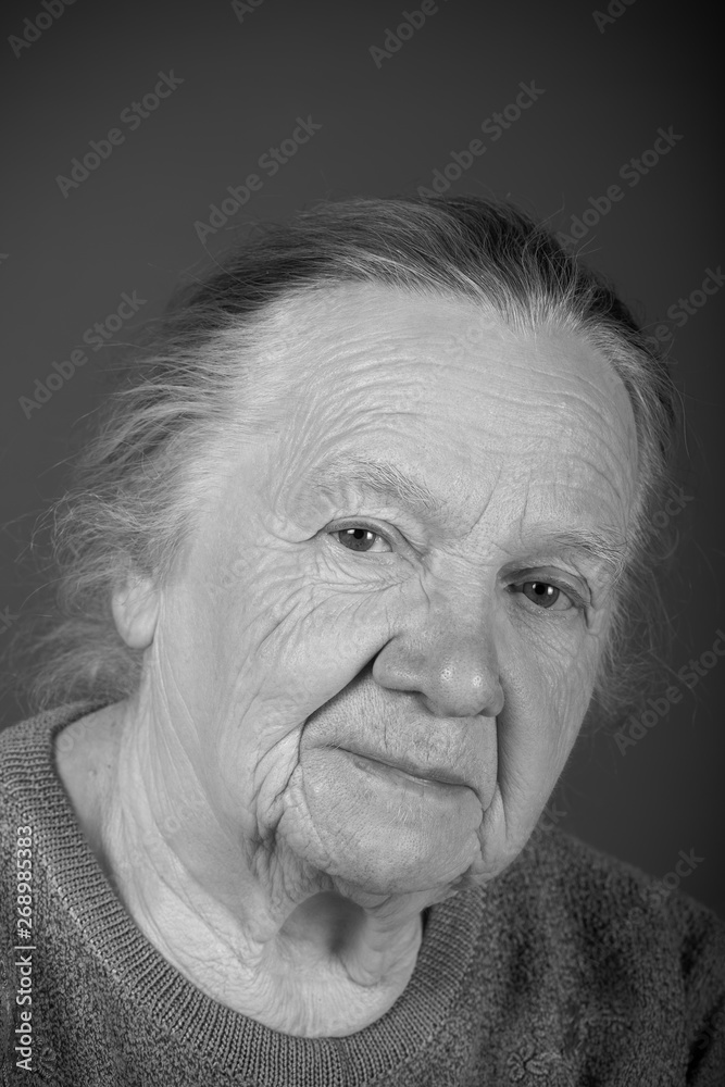 Portrait of elderly woman. Attentive look. Toned Portrait of elderly woman. Attentive look. Toned