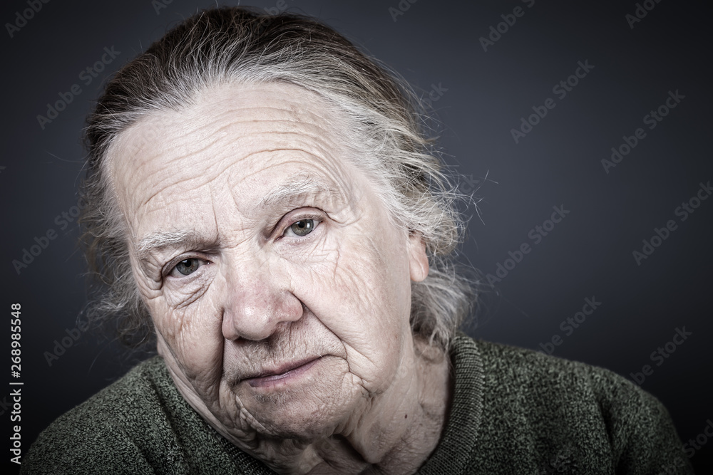 Portrait of elderly woman. Attentive look. Toned Portrait of elderly woman. Attentive look. Toned