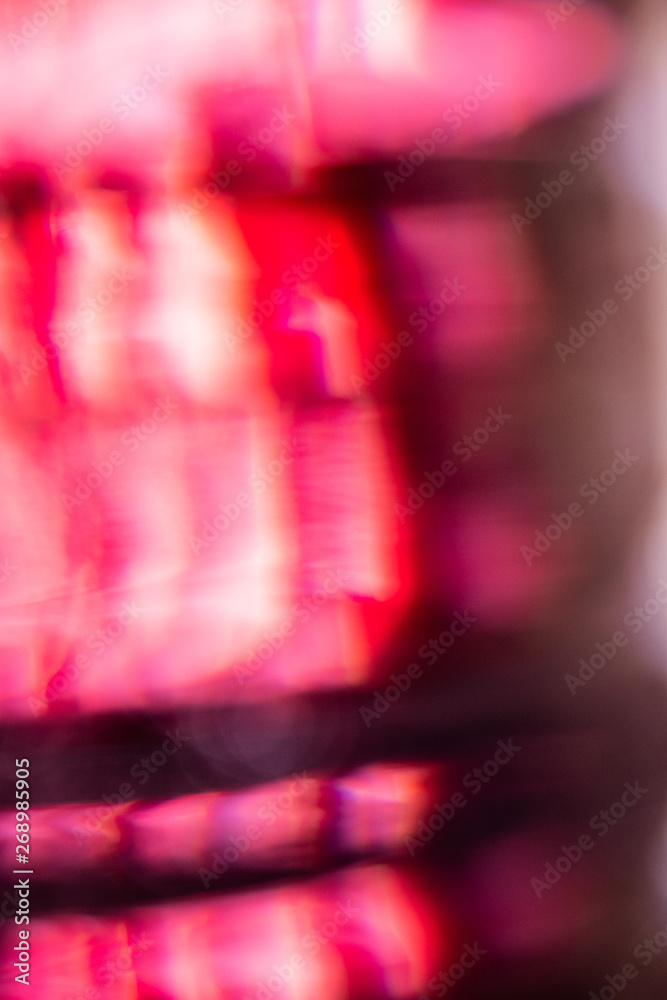 Red, white and pink out of focus abstract background 