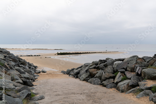 access to the beach protected by stone breezes against tidal erosion