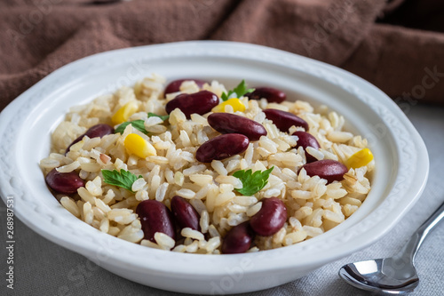 Rice with red beans in bowl .