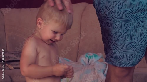 Daddy and little baby are playing   Relationship between parents and children expression of love care and emotions