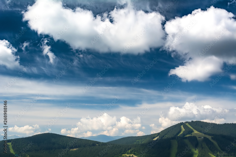Beautiful clouds over the mountains. Summer landscape
