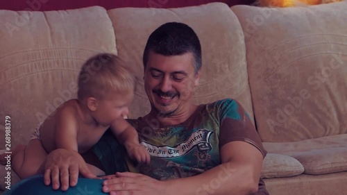 Daddy and little baby are playing   Relationship between parents and children expression of love care and emotions