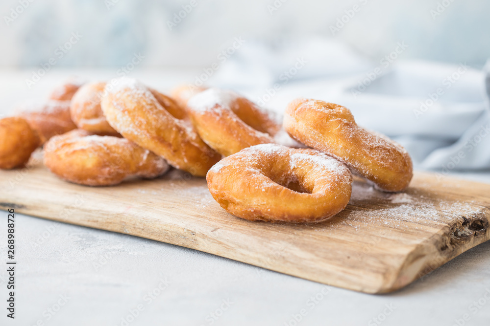 Glazed caramel doughnuts. A close up of fresh glazed doughnuts in a studio setting. donut