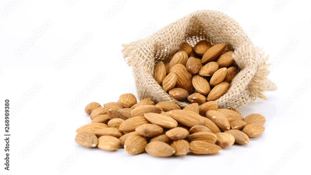 almonds nuts organic closeup texture on white background, healthy food ,health care eat vegetables and useful foods. almonds nuts organic closeup texture on white background, healthy food ,health care eat vegetables and useful foods.
