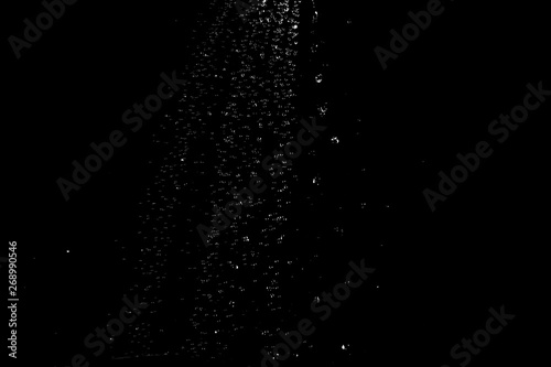 water splash drop to the ground on Black background . Close up of splash of water forming explode shape
