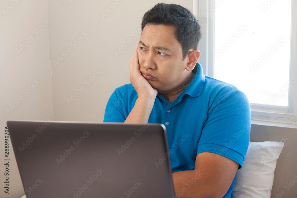 Man with Laptop, Thinking Expression Man with Laptop, Thinking Expression