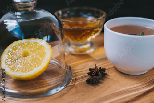 Lemon, star anise, honey and tea on stand