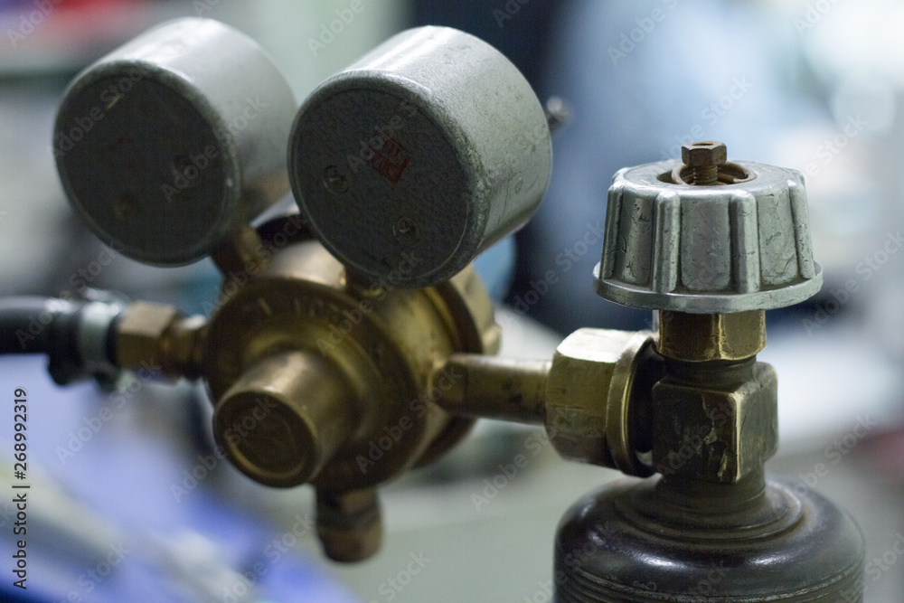 Close-up of pressure sensors on an oxygen cylinder with inscriptions in Russian Close-up of pressure sensors on an oxygen cylinder with inscriptions in Russian