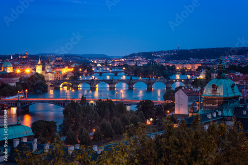 Beautiful Prague and its bridges at night / Aerial night view of famous bridges in Old Town of Prague in Czech Republic over Vltava river
