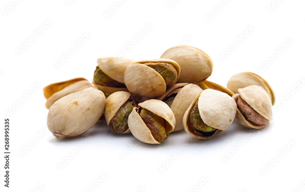 Pistachio nuts. Isolated on a white background Pistachio nuts. Isolated on a white background