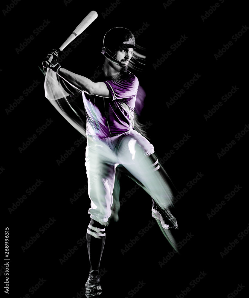Obraz premium one caucasian baseball player man studio shot isolated on black background with light painting speed effect