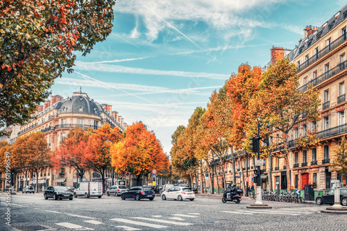 Streets of Paris, France. Blue sky, buildings and traffic. © Augustin Lazaroiu