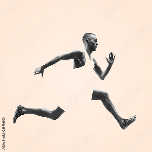 Young caucasian man running isolated on studio background. One male runner or jogger. Healthy lifestyle, movement, action, motion, advertising and sports concept. Abstract design.