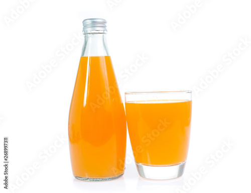 Orange juice in glass bottle isolated on white background