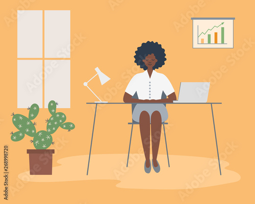 Office worker in the workplace. Young black woman is sitting at the desk in the yellow office room. There is a laptop, a lamp, a diagram and a flower in the picture. Funky flat style. Vector
