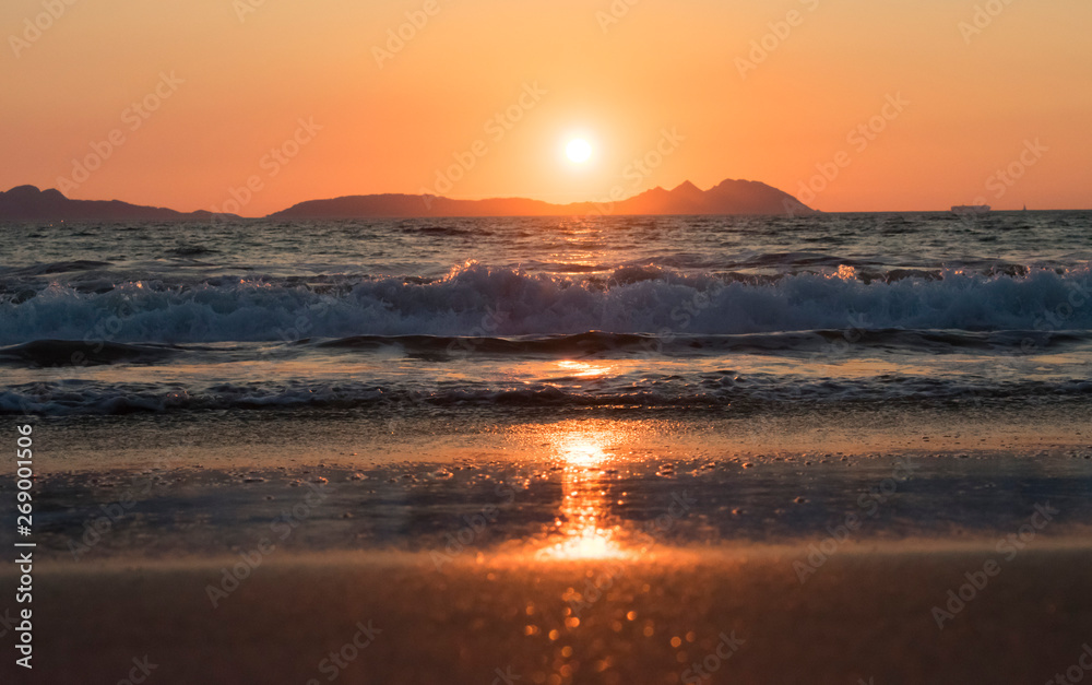 Beautiful sunset reflected on the beach