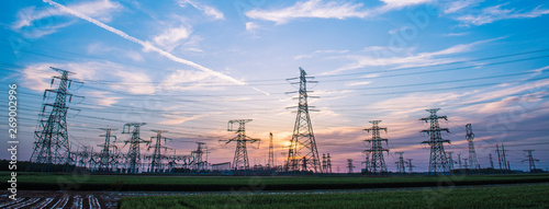 Silhouette of Power Supply Facilities at Sunset photo