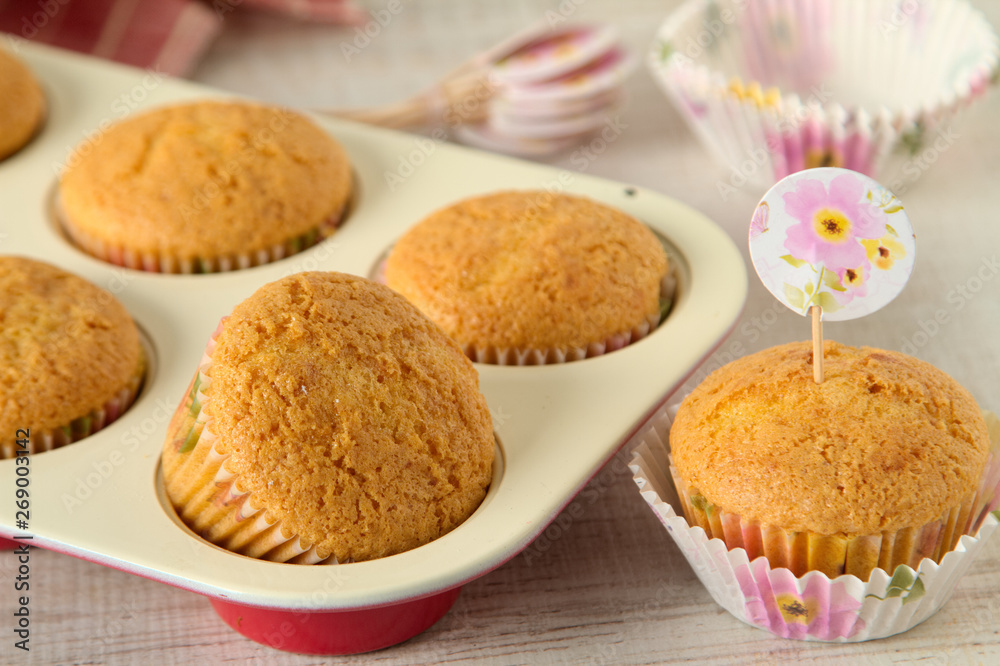 Yogurt muffins with healthy and simple ingredients on a table, close up Yogurt muffins with healthy and simple ingredients on a table, close up