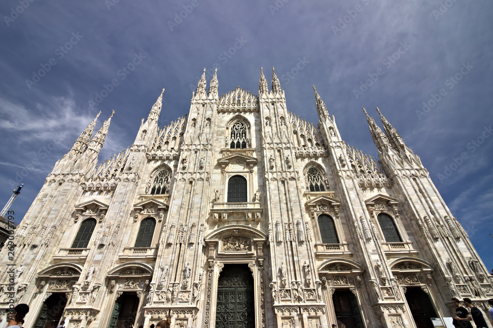 Milan Cathedral facade with  blue sky.