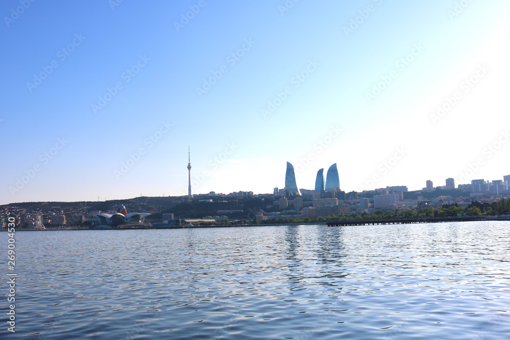 View  from The Caspian Sea to Flame Towers. Baku Flame Towers is the tallest skyscraper in Baku, Azerbaijan