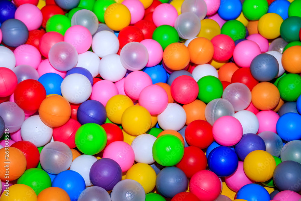 Background colored balls for a dry pool. Bright colors of balls. Plastic balls a lot