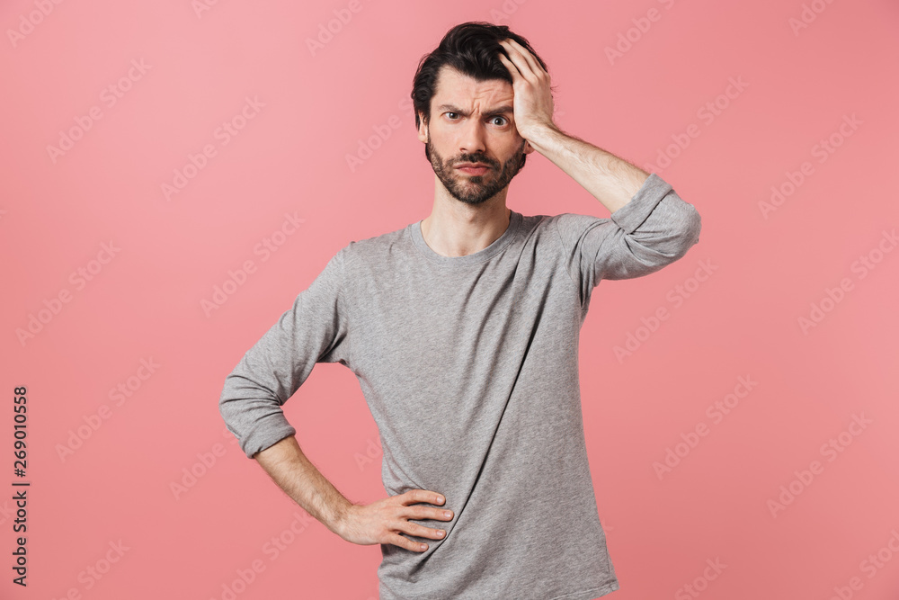 Handsome pensive young bearded brunette man Handsome pensive young bearded brunette man