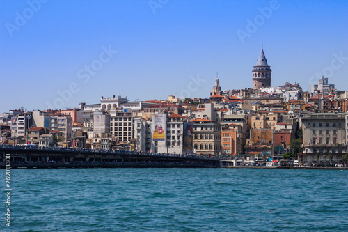 Istanbul, Turkey - June 26, 2017: Turquoise water of the Bosphorus Strait from Istanbul. Bridge over the Bosphon with Galata Tower © Tanya Hendel