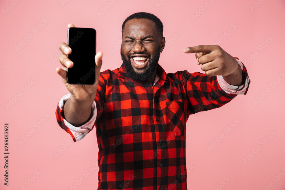 Portrait of a happy casual african man standing isolated Portrait of a happy casual african man standing isolated