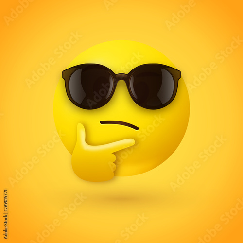 Thinking face emoji with sunglasses - emoticon face shown with a single finger and thumb resting on the chin wearing hipster sunglasses on yellow background photo