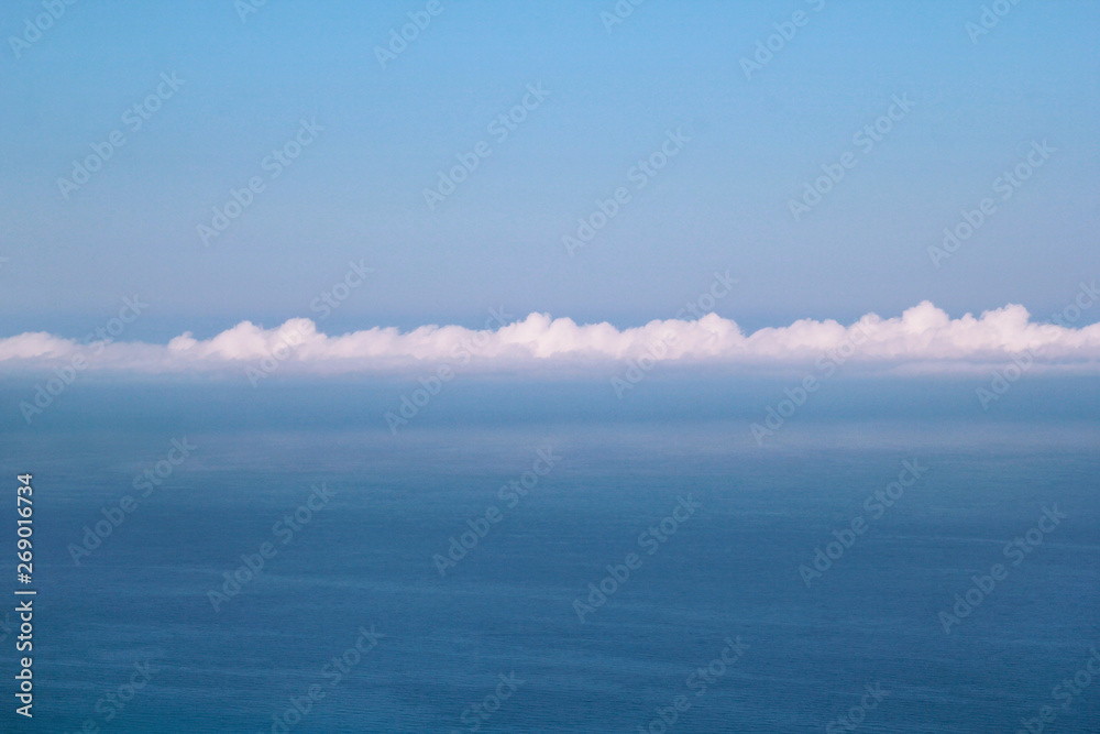 Sea, sky, beautiful structure of clouds, majestic landscape with seascape at calm blue water on horizon of mediterranean coast. Beautiful view, natural environment. Summer season, travel and holiday.