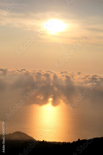 Sea, sky, beautiful structure of clouds, majestic landscape with seascape at calm sunset on horizon of mediterranean coast. Amazing sunset vibes on edge ocean. Sunrise over sea, natural environment.