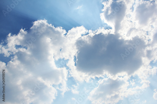 Beautiful sky. Rays of the sun behind the clouds. Background