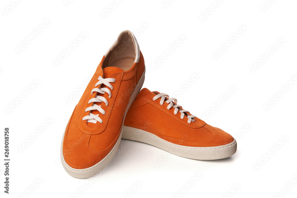 Orange casual suede shoes isolated on white