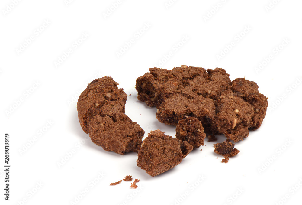 Crumbled granola cookies with chocolate and hazelnuts isolated on white background. Close up Crumbled granola cookies with chocolate and hazelnuts isolated on white background. Close up