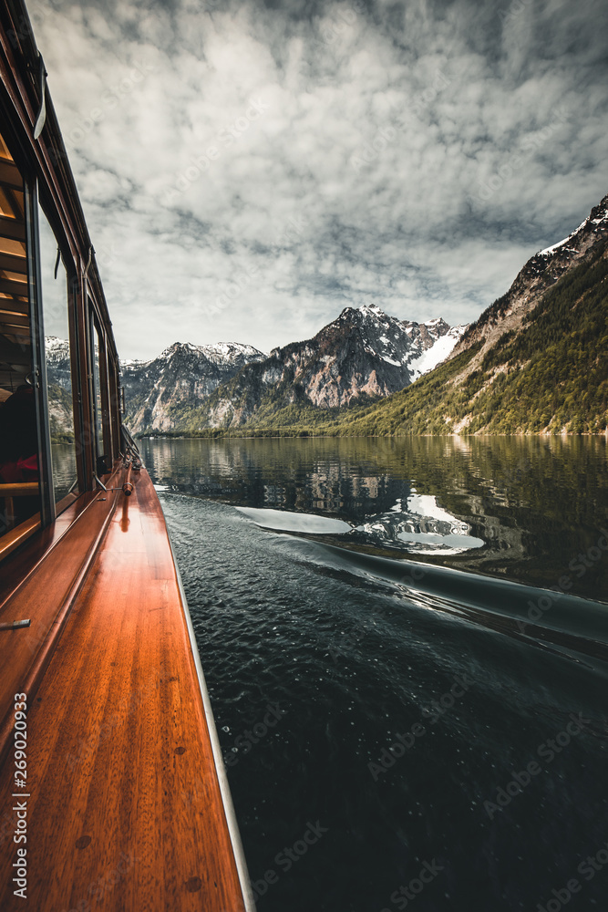 boat drive on the Königssee in Berchtesgaden in Germany Bavaria. a very beautiful lake with reflecting mountains in the water.