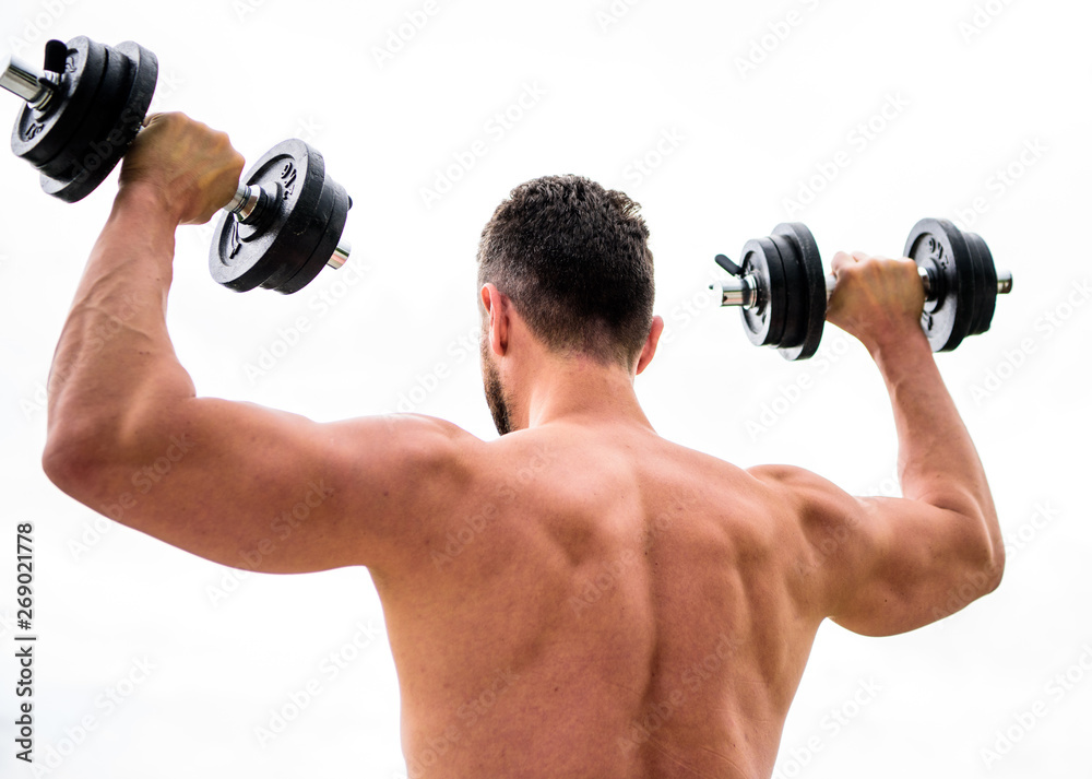 fitness and sport equipment. athletic body. Dumbbell gym. man sportsman weightlifting. steroids. Muscular back man exercising in morning with barbell. Healthy lifestyle. mens power fitness and sport equipment. athletic body. Dumbbell gym. man sportsman weightlifting. steroids. Muscular back man exercising in morning with barbell. Healthy lifestyle. mens power